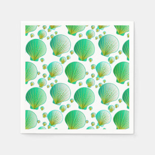 Seafoam green seashells on white napkin