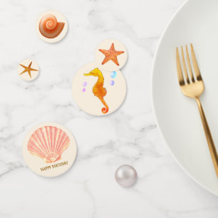 Seahorse, shells, stars & pearl on ivory table confetti