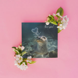 seal blowing heart bubbles