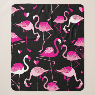 Seamless pattern from pink flamingos on a dark bac sherpa blanket