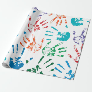 Seamless pattern of multicolored human hands on a wrapping paper