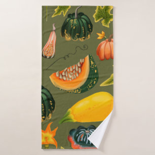 Seamless pattern of pumpkins and leaves on a green bath towel
