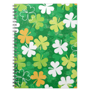 Seamless pattern of scattered clovers and shamrock notebook