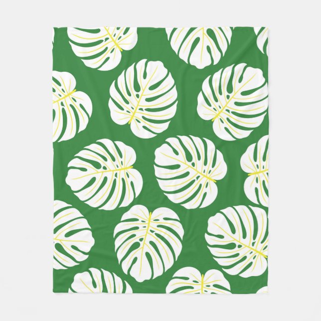 Seamless pattern of white monstera leaves on a dar fleece blanket (Front)