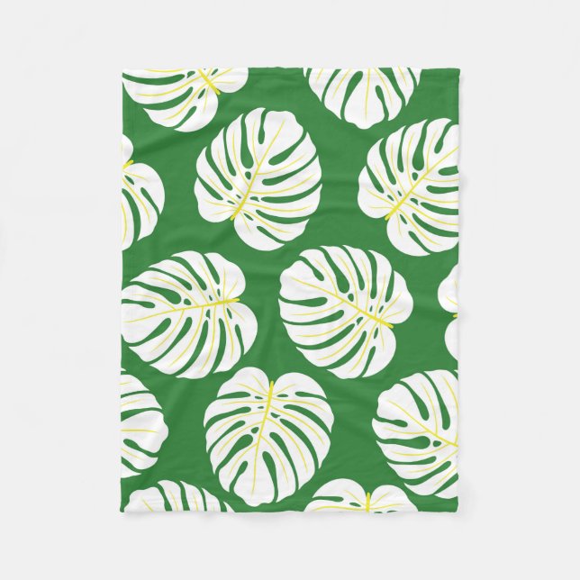 Seamless pattern of white monstera leaves on a dar fleece blanket (Front)