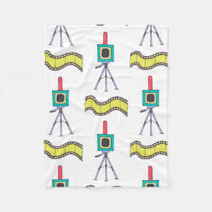 Seamless pattern with cameras and film strips on a fleece blanket