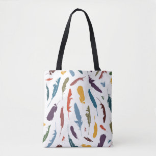 Seamless pattern with colored feathers on a light. tote bag
