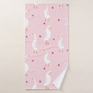 Seamless pattern with cute duck with heart on pink bath towel