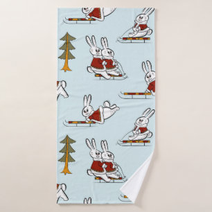 Seamless pattern with different rabbits on sleds i bath towel