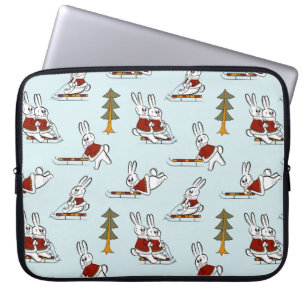 Seamless pattern with different rabbits on sleds i laptop sleeve