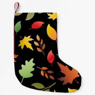 Seamless pattern with fallen autumn leaves and col small christmas stocking