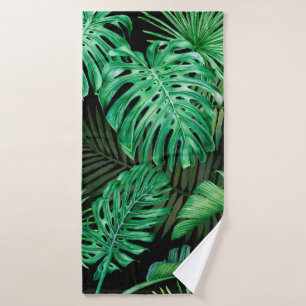 Seamless pattern with tropical leaves on a dark ba bath towel