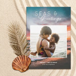 Seas and Greetings Beach Sunset Painting Photo Holiday Card<br><div class="desc">These beautiful holiday photo cards feature a beach sunset painting in the background and a rectangular (almost square) photo template. Stylish, modern typography reads, "Seas & Greetings." Easy to personalize. The back is dark teal blue - Leave as is or customize the color, if desired. Add more photos to the...</div>
