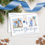 Seas and Greetings Coastal Wood Holiday Photo<br><div class="desc">Seas and Greetings Seashell Ornament on Coastal Wood Holiday Photo Christmas Post Cards featuring ocean navy blue and sandy tan shell ornaments hanging from sailing jute rope on coastal shiplap wood with elegant typography. Add two of your photos and a personal message for a fun nautical holiday card that is...</div>