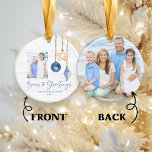 Seas and Greetings Seashell Holiday Photo Ceramic Tree Decoration<br><div class="desc">Seas and Greetings Seashell Ornament on Coastal Wood Holiday Christmas Photo Ornaments featuring ocean navy blue and sandy tan shell ornaments hanging from sailing jute rope on coastal shiplap wood with elegant typography. Add two of your photos and a personal message for a fun nautical holiday ornament or gift. Please...</div>