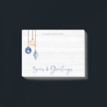 Seas and Greetings Seashell Ornament Coastal Wood Post-it Notes<br><div class="desc">Seas and Greetings Seashell Ornament on Coastal Wood Holiday Christmas notepad featuring ocean navy blue and sandy tan shell ornaments hanging from sailing jute rope on coastal shiplap wood with elegant typography. Add your name for a fun nautical holiday gift. Please contact us at cedarandstring@gmail.com if you need assistance with...</div>