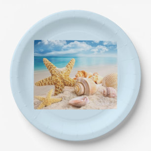 Seashells on the round beach paper plates