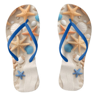 Seashells, starfish, and pebbles on a sandy beach  jandals