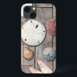 Seashore Treasures iPhone 13 Case<br><div class="desc">Megan Meagher is known for her simple art pieces. This image captures the simplicity of the seashore's treasures, including sand dollars and seashells in a pastel coloured tone. Meagher encompasses a wooden background in her image to contrast these treasures. Get this fine art print today on wood colour on your...</div>