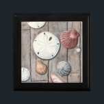 Seashore Treasures Gift Box<br><div class="desc">Megan Meagher is known for her simple art pieces. This image captures the simplicity of the seashore's treasures, including sand dollars and seashells in a pastel coloured tone. Meagher encompasses a wooden background in her image to contrast these treasures. Get this fine art print today on wood colour on your...</div>