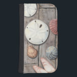 Seashore Treasures Samsung S4 Wallet Case<br><div class="desc">Megan Meagher is known for her simple art pieces. This image captures the simplicity of the seashore's treasures, including sand dollars and seashells in a pastel coloured tone. Meagher encompasses a wooden background in her image to contrast these treasures. Get this fine art print today on wood colour on your...</div>