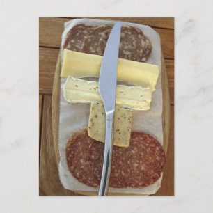 Selection of gourmet cheeses and cut meats postcard