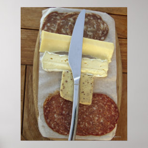 Selection of gourmet cheeses and cut meats poster
