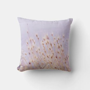SELECTIVE FOCUS PHOTOGRAPHY OF GRASS FIELD CUSHION