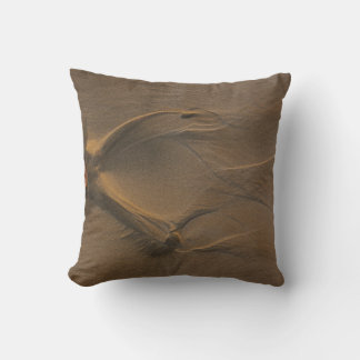 Selective focus photography of sand cushion