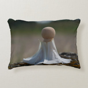 Sensually wrapped doll in a flower dress. decorative cushion
