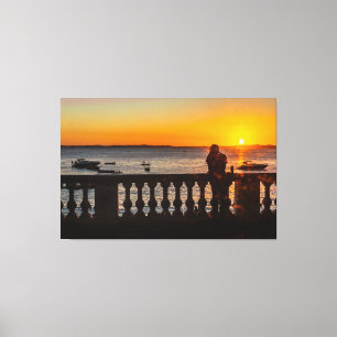Serene Ocean Sunset Through Historic Balustrade Canvas Print