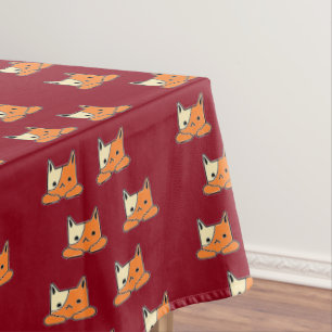 Serious cats on brown tablecloth