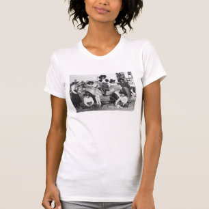 Seven rodeo cowgirls jokingly posing with a donkey T-Shirt