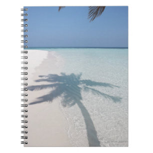 Shadow of a palm tree on a deserted island beach spiral notebook