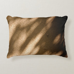 Shadow on brown carpeted floor decorative cushion