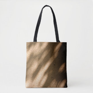 Shadow on brown carpeted floor tote bag