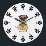 Shalom!-Cute Pug dog with Menorah<br><div class="desc">This is a cute little wall clock for your child's room, featuring a sweet little cartoon Pug dog wearing a yarmulke, and a menorah in front of him. Around the edges, next to the numbers are cute little paw prints! Below the dog is the word "Shalom!" You can customise the...</div>