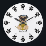 Shalom!-Cute Pug dog with Menorah Large Clock<br><div class="desc">This is a cute little wall clock for your child's room, featuring a sweet little cartoon Pug dog wearing a yarmulke, and a menorah in front of him. Around the edges, next to the numbers are cute little paw prints! Below the dog is the word "Shalom!" You can customise the...</div>