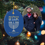 Shalom Peace on Earth Hanukkah Holiday Photo Ceramic Tree Decoration<br><div class="desc">Shalom Peace on Earth Hanukkah Holiday Photo Ornament - the perfect complement for your interfaith family! Festive Hanukkah blue with an elegant silver menorah and gold Hebrew Shalom - Peace on Earth! Easy to customize with text, fonts, and colors. Created by Zazzle pro designer BK Thompson exclusively for Kate’s Creations;...</div>