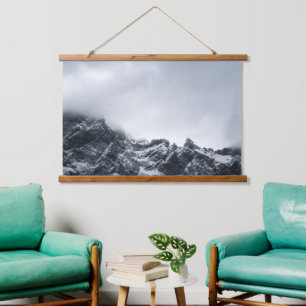 Sharp edges of mountains and soft clouds hanging tapestry