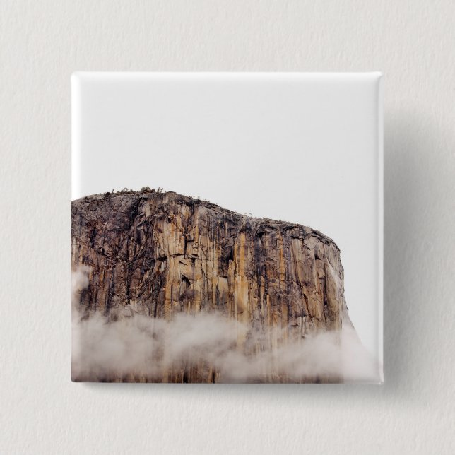Sheer cliff rising above clouds 15 cm square badge (Front)