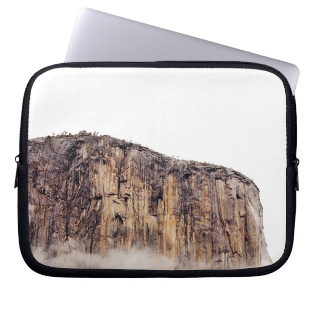 Sheer cliff rising above clouds laptop sleeve (Front)
