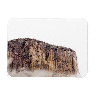 Sheer cliff rising above clouds magnet