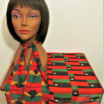 Shell African Colour Designer Crochet Print Chiffo Scarf<br><div class="desc">Red black and green striped image with white African cowrie shell printed on chiffon scarf is from a photo of an original crocheted creation designed handmade and Copyright © by published designer Delores Chamblin. The picture of the rectangular handcrafted clutch bag is repeated on the sheer fabric of the neckwear...</div>