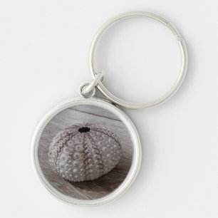 Shell On Top Of A Wooden Table Key Ring