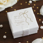 She's Tying the Knot Bridal Shower Pearl Bow  Classic Round Sticker<br><div class="desc">Add a delicate finishing touch to your celebration with this Pearl Bow “She’s Tying the Knot” bridal shower classic round sticker, designed with an elegant bow motif and refined script typography. Perfect for sealing envelopes, decorating favours, gift wrap, and bridal shower packaging, this sticker enhances a romantic, coquette, and feminine...</div>