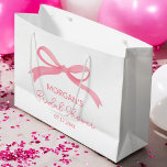 She's Tying The Knot Pink Bow Bridal Shower Large Gift Bag<br><div class="desc">Celebrate the bride-to-be with the "She's Tying The Knot" Pink Bow Bridal Shower Large Gift Bag. This lovely bag features a delicate pink bow design, adding an elegant touch to any bridal shower. Perfect for holding small gifts, treats, or party favours, this bag is both stylish and practical. Its soft...</div>