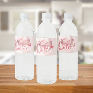 She's tying the knot pink bow Team Bride Water Bottle Label