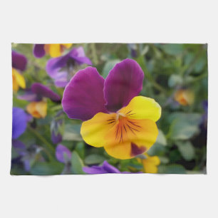 Shining pansies tea towel