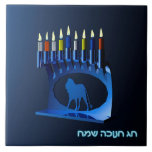 Shiny Blue Chanukkah Menorah Tile<br><div class="desc">A modernistic,  metallic,  blue Chanukkah menorah,  featuring a lion in silhouette,  against a dark,  night-like background. All nine of the candles are lit. Hebrew text reading "Chag Chanukkah Sameach" (Happy Hanukkah) also appears in glowing blue and white.</div>